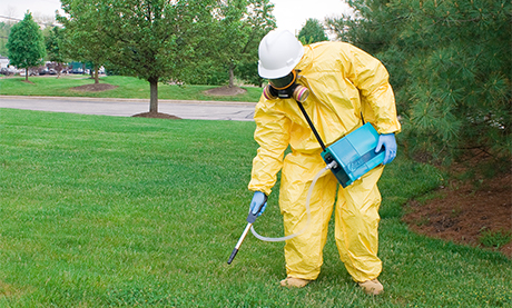 Field Technician in Hazmat Monitoring Mercury Outside Using the RA-915M Mercury Analyzer