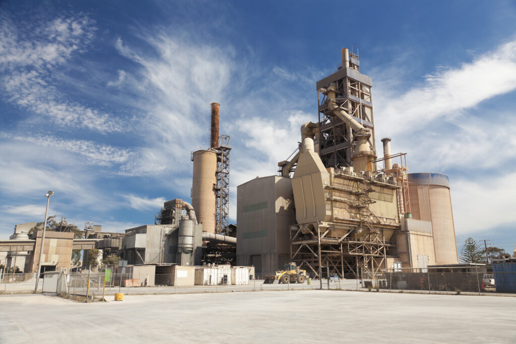 View of a cement factory against blue sky
