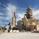 View of a cement factory against blue sky